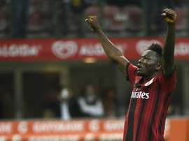 AC Milan midfielder Sulley Muntari celebrates after scoring during the Italian Serie A football match AC Milan vs Chievo Verona on October 4, 2014.