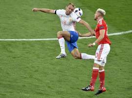 Russia international Denis Glushakov (left) scored the only goal as Spartak Moscow beat nine-man Rostov 1-0 to go top of the Premier League
