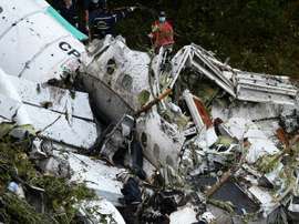 Rescue teams work on the recovery of bodies of victims of the crash in Colombia. AFP