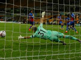 Wolves French defender Rayan Aït-Nouri (R) scores the opener. AFP