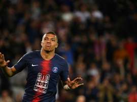 Kylian Mbappe scored a hat-trick against his old team. AFP