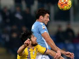Lazios forward Filip Djordjevic (R) heads the ball with Sampdorias defender Ervin Zukanovic during an Italian Serie A football match at the Olympic Stadium in Rome on December 14, 2015