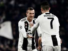Bernadeschi with teammate Cristiano Ronaldo. AFP