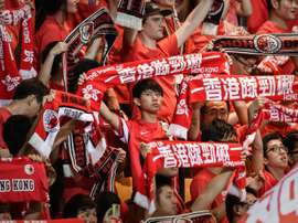Local football fans watch a 2018 World Cup qualifying match, Hong Kong vs Qatar, in Hong Kong, on September 8, 2015