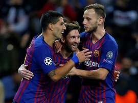 Lionel Messi celebrates his goal with Luis Suárez and Ivan Rakitic. AFP