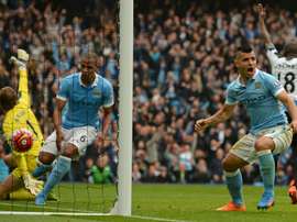 Manchester Citys Sergio Aguero (R) celebrates after scoring a goal during their English Premier League match against Newcastle United, at the Etihad Stadium in Manchester, on October 3, 2015