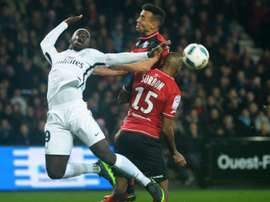 Paris Saint-Germains Jean-Kevin Augustin (L) vies with Guingamps Jeremy Sorbon. AFP