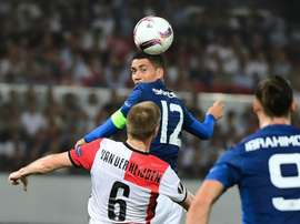 Manchester Uniteds Chris Smalling heads the ball during their UEFA Europa League Group A match against Feyenoord Rotterdam, at the Feyenoord Stadium in Rotterdam, on September 15, 2016