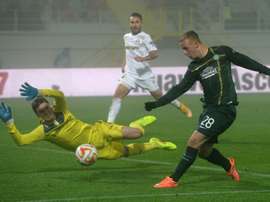 Leigh Griffiths (R) scored the first goal for Celtic after the champions were awarded a penalty four minutes into the match against Ross County, as the new season of the Scottish Premiership got underway