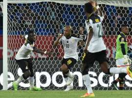 Ghana forward Andre Ayew (no. 10) celebrates with team-mates after scoring. AFP