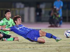 Japans Gamba Osaka defender Koki Yonekura scores against South Koreas Jeonbuk Hyundai Motors for the game deciding goal during the football quarter-final of the AFC champions league in Osaka on September 16, 2015