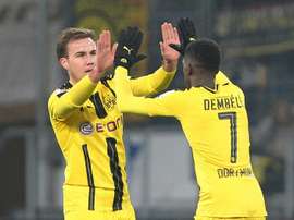 Dortmunds midfielder Mario Goetze celebrates scoring the 1-1 with Dortmunds midfielder Ousmane Dembele during the Bundesliga football match against Hoffenheim December 16, 2016