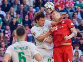 Sule (r) got the only goal in the victory over Bremen. AFP