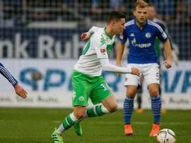Wolfsburgs midfielder Julian Draxler (L) playing against FC Schalke, a game his team went on to lose, prompting fans to boo them