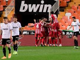 Atletico Madrid beat Valencia in La Liga thanks to an own goal. AFP