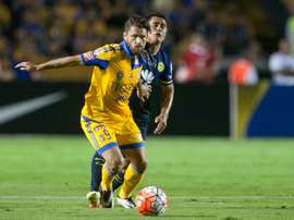Tigres Rafael Sobis (L) tries to break clear of Club Americas Osvaldo Martinez during their Concacaf Champions League first leg final, in Monterrey, Mexico