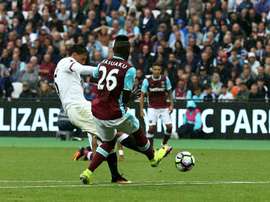 Watfords midfielder José Holebas (L) scores his teams fourth goal during the English Premier League football match against West Ham United on September 10, 2016