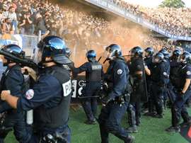 Fans stormed the pitch. AFP