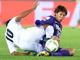 Sanfrecce Hiroshimas Takuya Marutani (right) battles for the ball with Auckland City forward Ryan de Vries during their FIFA Club World Cup match in Yokohama, Japan, on December 10, 2015