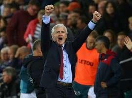 Hughes celebrates a victory against Swansea City last season. AFP
