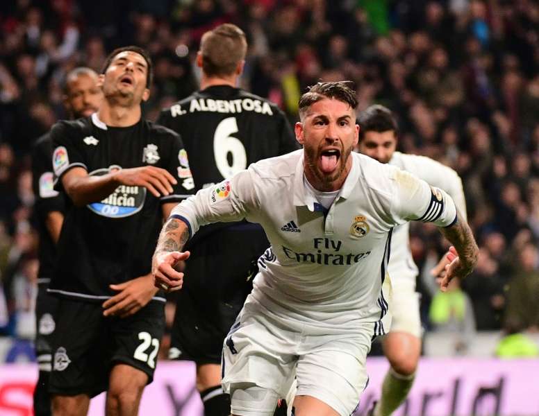 Real Madrids captain Sergio Ramos celebrates after scoring a goal during their Spanish La Liga match against Deportivo la Coruna, at the Santiago Bernabeu stadium in Madrid, on December 10, 2016