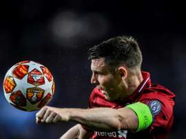 James Milner in Champions League action for Liverpool. AFP