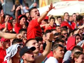 An Albania supporter reacts in Tiranas main boulevard fan zone on June 11, 2016