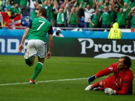 McGinn celebrates scoring against Ukraine at Euro 2016. AFP