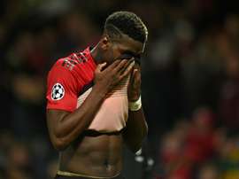 Paul Pogba looks dejects as United miss the chance to finish top. AFP