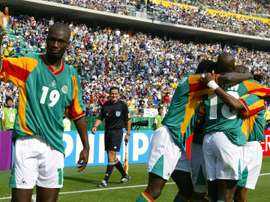 Papa Bouba Diop celebrates after a Camara goal against against Sweden at the 2002 World Cup. AFP