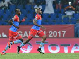 Democratic Republic of the Congos forward Junior Kabananga (R) celebrates with midfielder Merveille Bokadi after scoring a goal on January 16, 2017