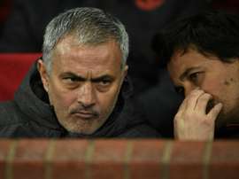 Jose Mourinho (L) talks with his assistant manager Rui Faria when the pair were at Man Utd.