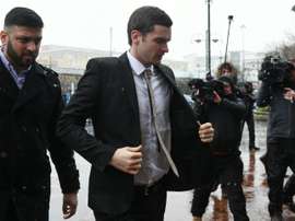 Former Sunderland footballer Adam Johnson (C) arrives at Bradford Crown Court in Bradford, northern England, on March 2, 2016