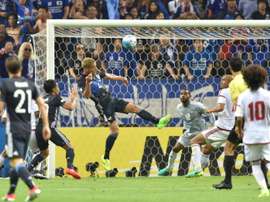 Japan should have finished the game 2-2 but the officials failed to spot. AFP