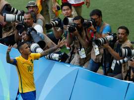 Neymar celebrates after scoring a penalty against Honduras. AFP