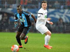 Marseilles forward Michy Batshuayi (L) vies for the ball with Granvilles midfielder Robin Theault (R) during the French Cup quarter final football match on March 3, 2016, at the Michel dOrnano stadium, in Caen, France
