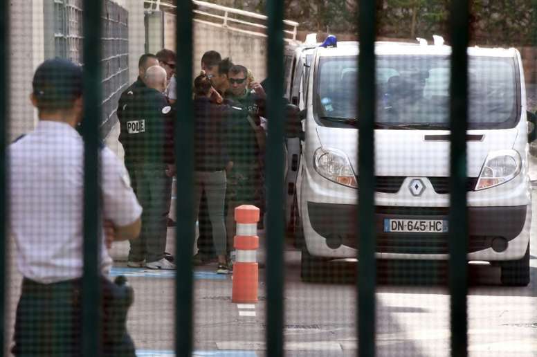 Russian supporters get into a police van before leaving the Marseille holding center to be expelled from France in Marseille on June 18, 2016