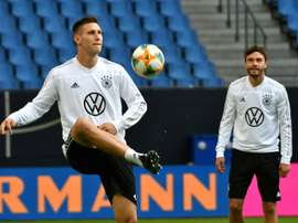 'Germany's van Dijk' - Suele learning to lead wobbly defence. AFP