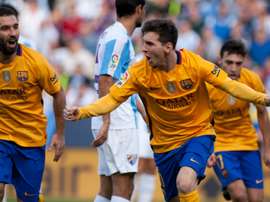 Barcelonas forward Lionel Messi celebrates after scoring during the Spanish league football match against Malaga at La Rosaleda stadium on January 23, 2016