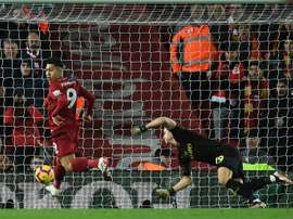 Roberto Firmino scores the first of his three goals. AFP