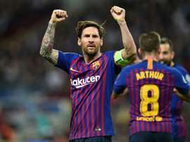 Messi celebrates victory against Tottenham Hotspur at Wembley. AFP