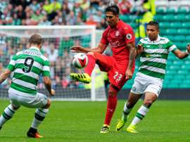 Celtics Scottish striker Leigh Griffiths (L) and Celtics Honduran defender Emilio Izaguirre (R) vie with Leicester Citys Argentinian striker Leonardo Ulloa (C) during match between Celtic and Leicester City in Glasgow, Scotland on July 23, 2016