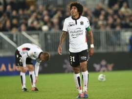 Nice defender Dante reacts (R) during their French League Cup match against Bordeaux. AFP