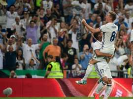 Real Madrids German midfielder Toni Kroos celebrates after scoring during the Spanish league football match Real Madrid CF vs RC Celta de Vigo at the Santiago Bernabeu stadium in Madrid on August 27, 2016