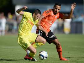 Nantes midfielder Jordan Veretout (L) vies with Lorient midfielder Walid Mesloub during the friendly at the Moreau-Desfarges stadium in La Baule-Escoublac, western France on July 22, 2015