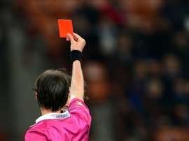 Trabzonspor players remonstrated with the referee in their game against Galatasaray before defender Salih Dursun pinched the referees card red and brandished it in front of him