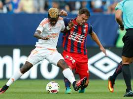 Lorient Gabonese midfielder Didier Ndong (L) is tackled by Caen defender Damien Da Silva. AFP