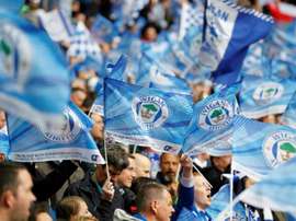 Wigan managed to bag a home win. AFP