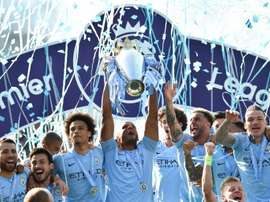 Manchester City with the Premier League title at the end of last season. AFP