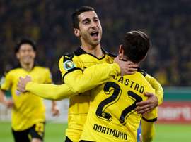 Dortmunds midfielder Gonzalo Castro celebrates scoring with midfielder Henrikh Mkhitaryan during the German Cup DFB second round football match in Dortmund, western Germany on October 28, 2015